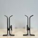 Pair of modernist and wrought iron fire dogs