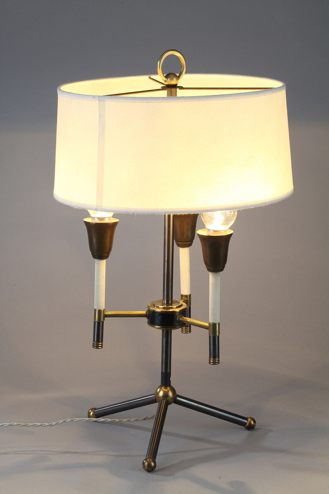 Modernist table lamp in black and gold lacquered metal