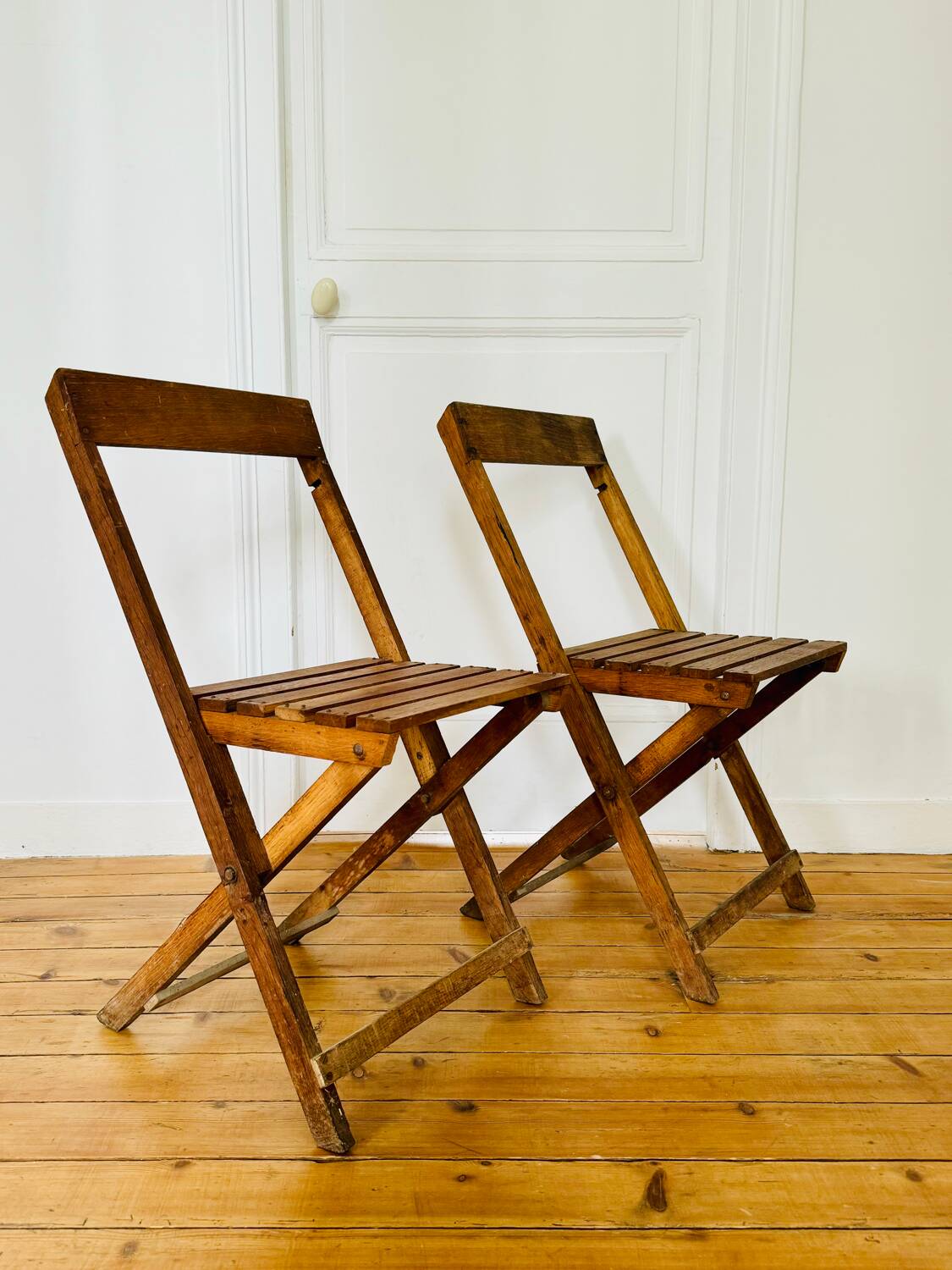 Two vintage wooden folding chairs, circa 1960