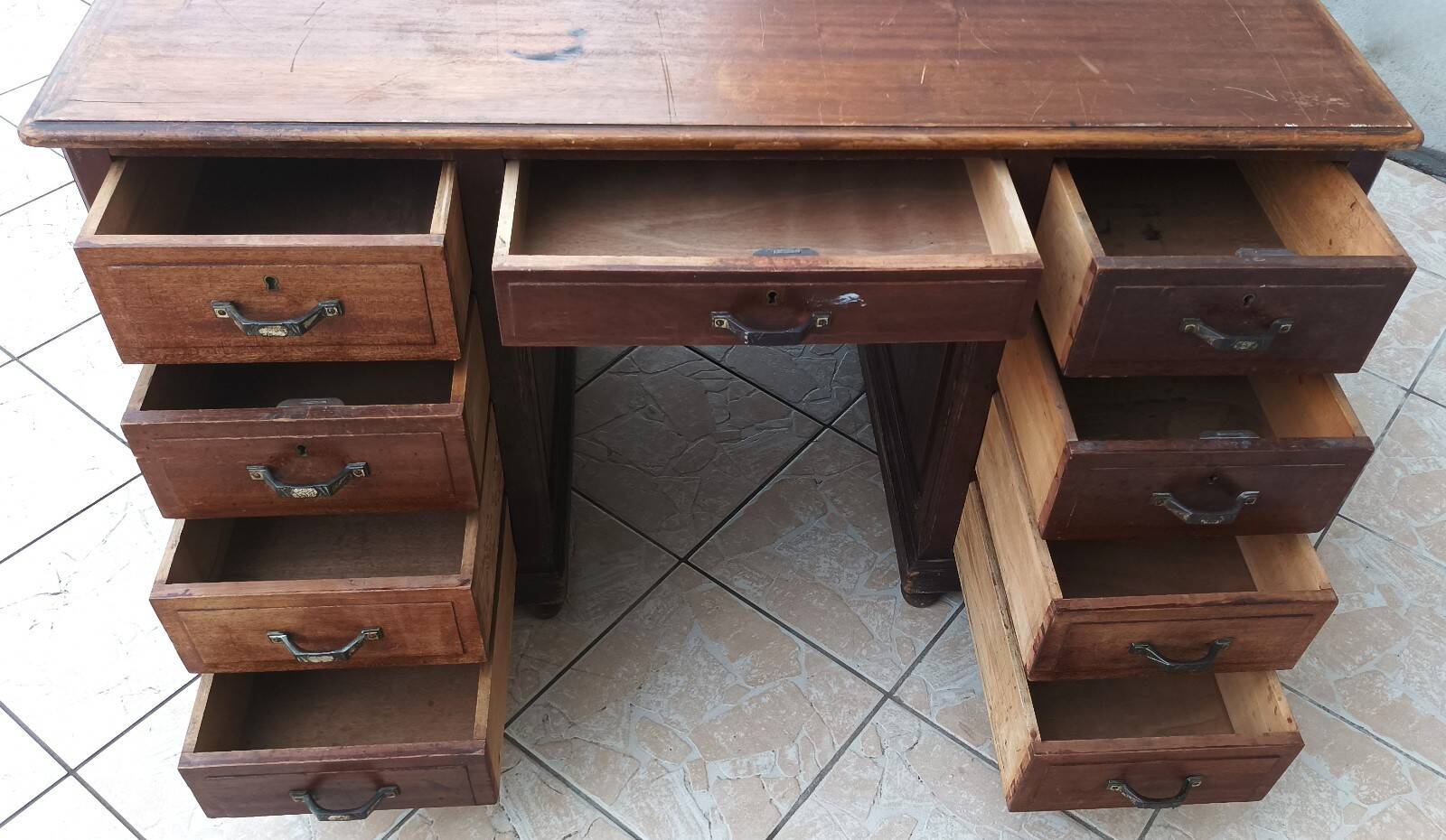 Vintage double-sided mahogany desk with 18 drawers.