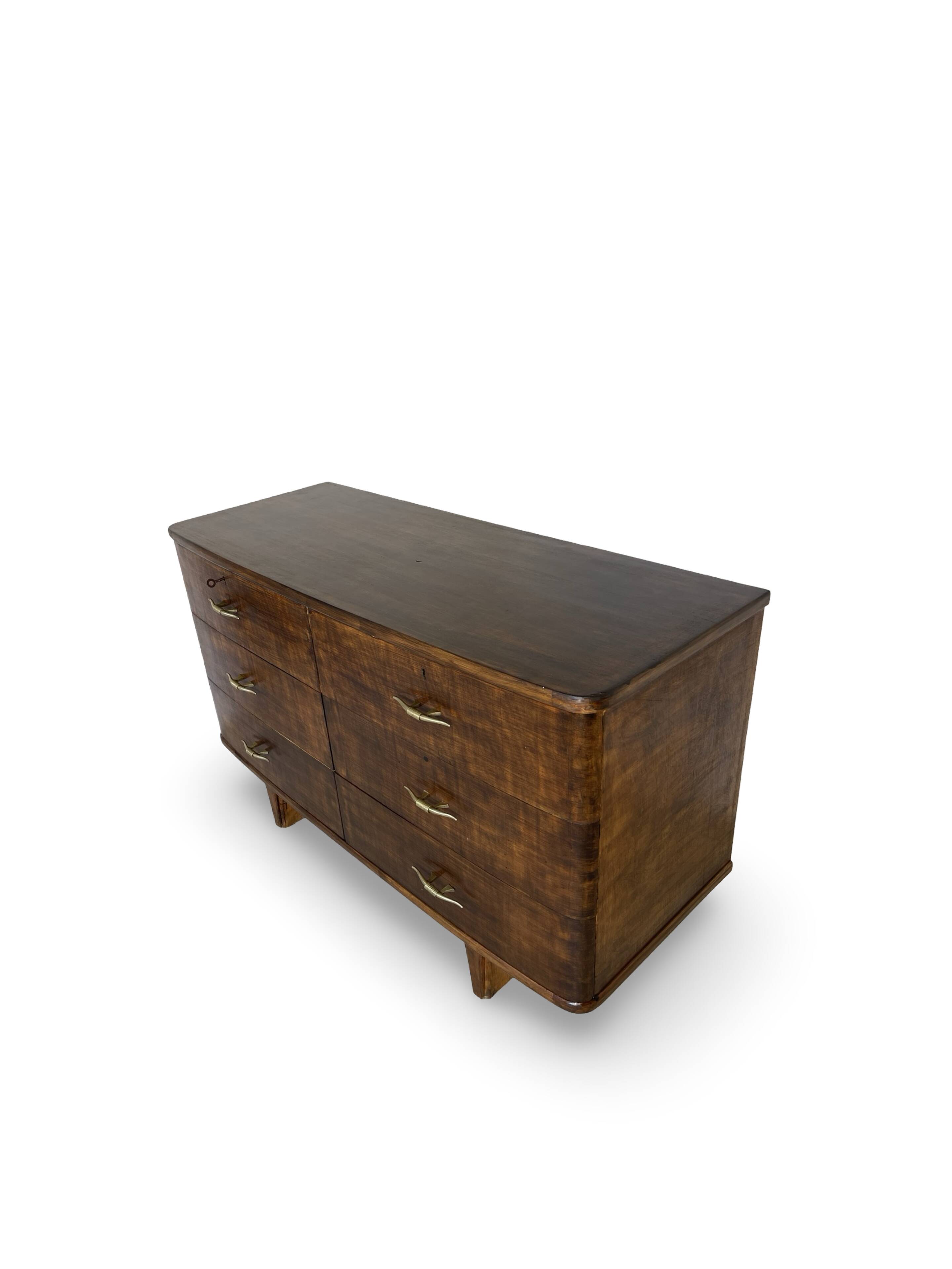 A vintage Italian chest of drawers, made of veneered walnut and solid wood,