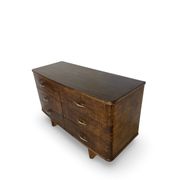 A vintage Italian chest of drawers, made of veneered walnut and solid wood,