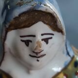 Antique earthenware salt cellar with a woman with baskets