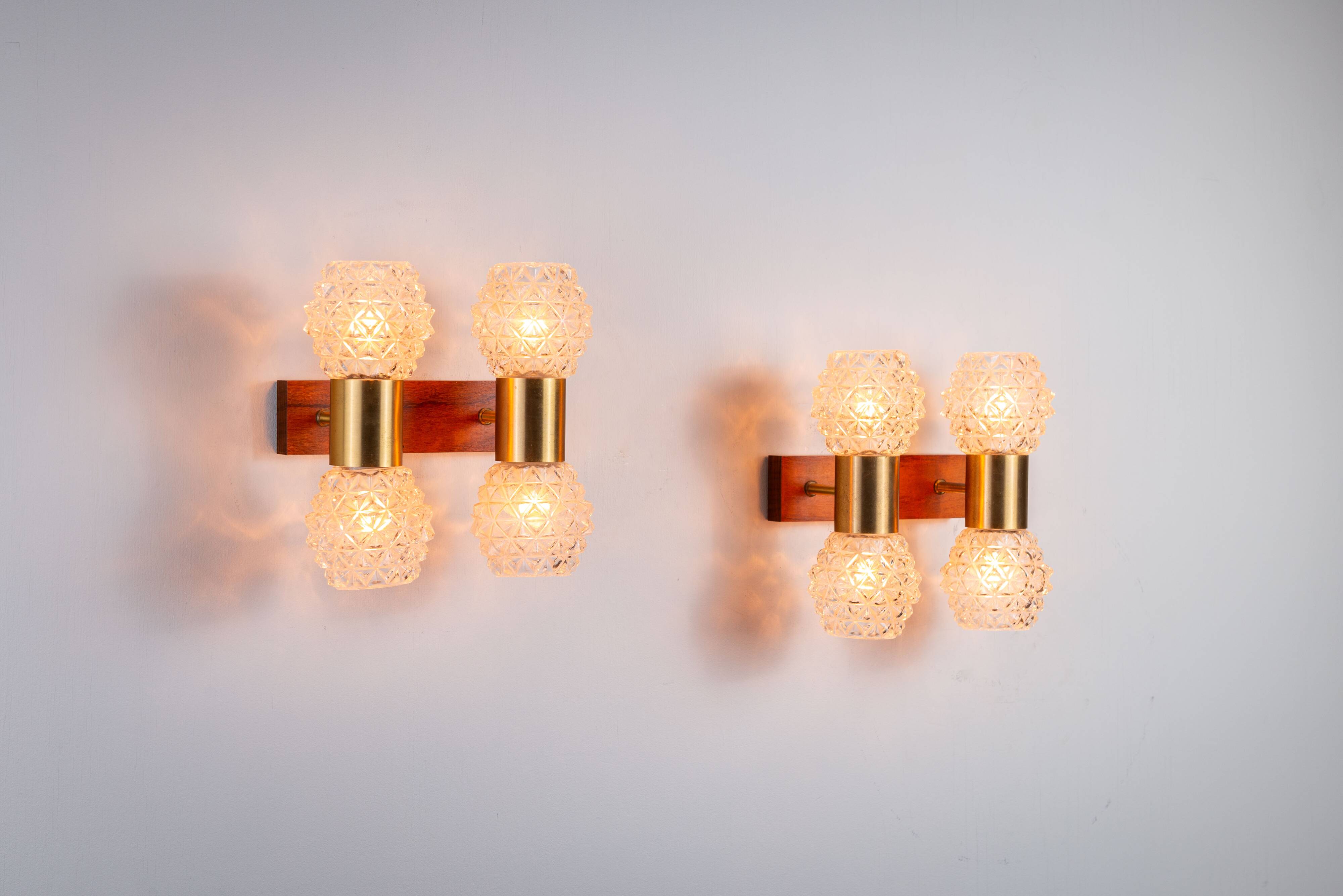Pair of Swedish wall lamps with teak wood, brass and glass cup shade