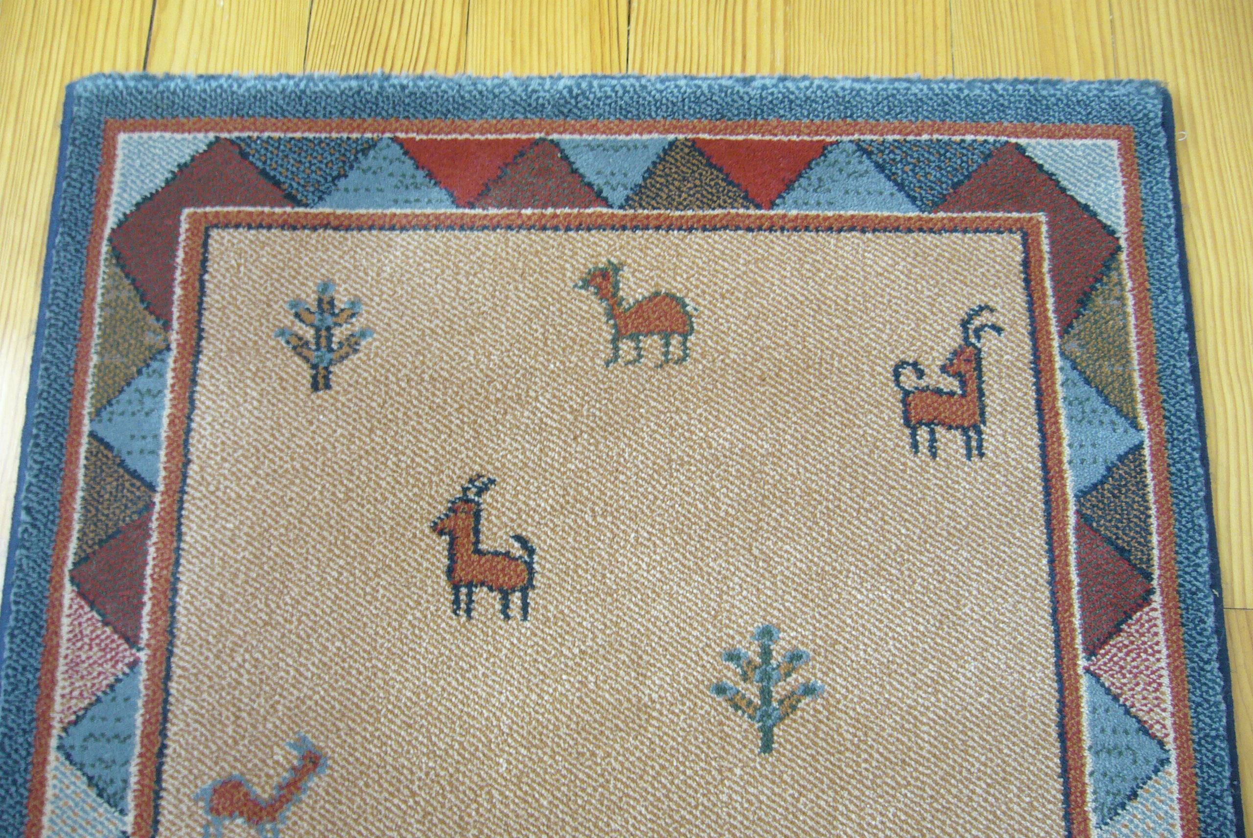 Pair of 60 x 120 Peruvian wool rugs
