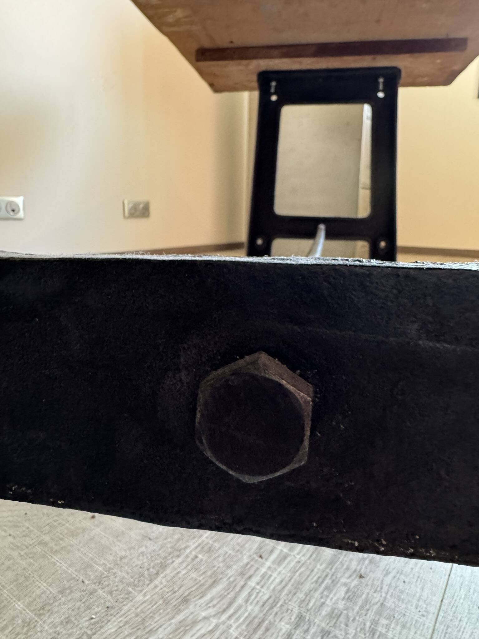 Industrial style table with a mahogany top.