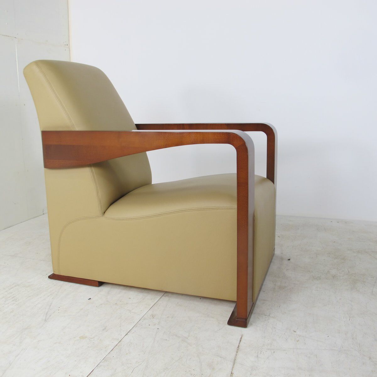 Leather armchair and art deco wood with Oottoman by Hugues Chevalier 2000s