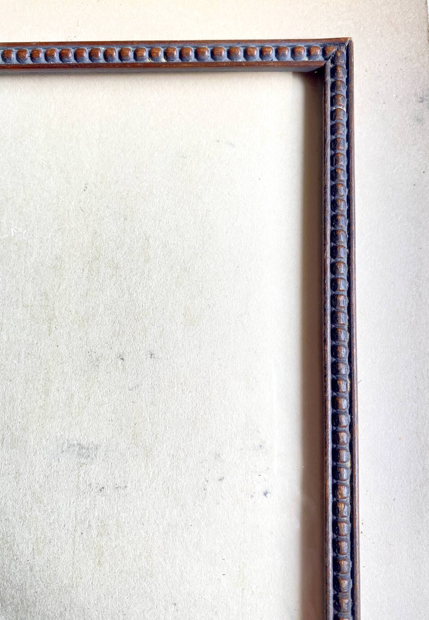 Wooden frame carved in beads, glazed, gray cardboard back and irzft paper