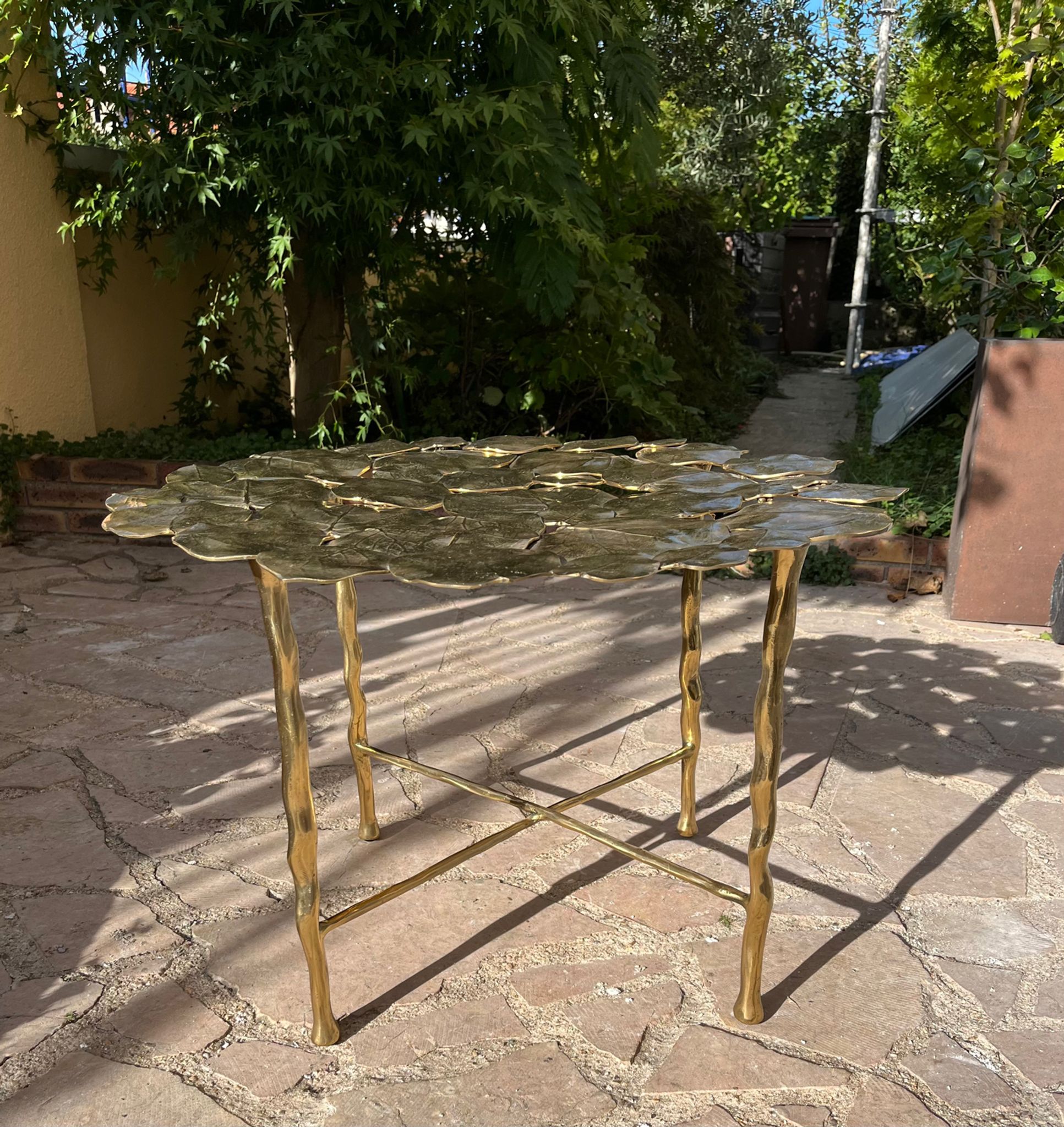 Carved brass coffee table with ginkgo decor