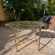 Carved brass coffee table with ginkgo decor