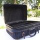 Old black wicker suitcase