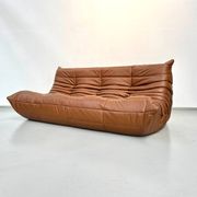 Three-seater Togo sofa in dark cognac leather by Michel Ducaroy for Ligne Roset.