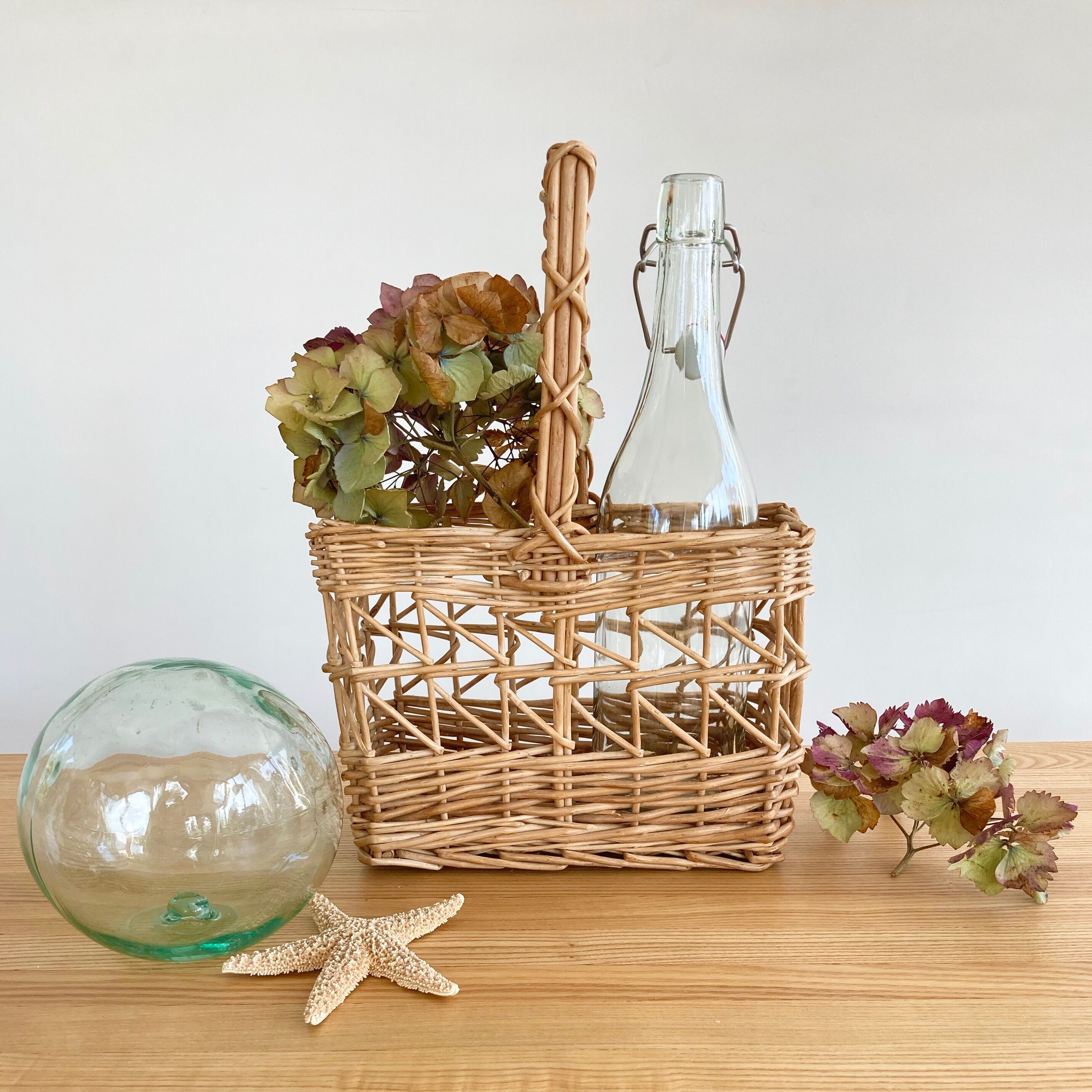 Vintage wicker bottle-bearer basket