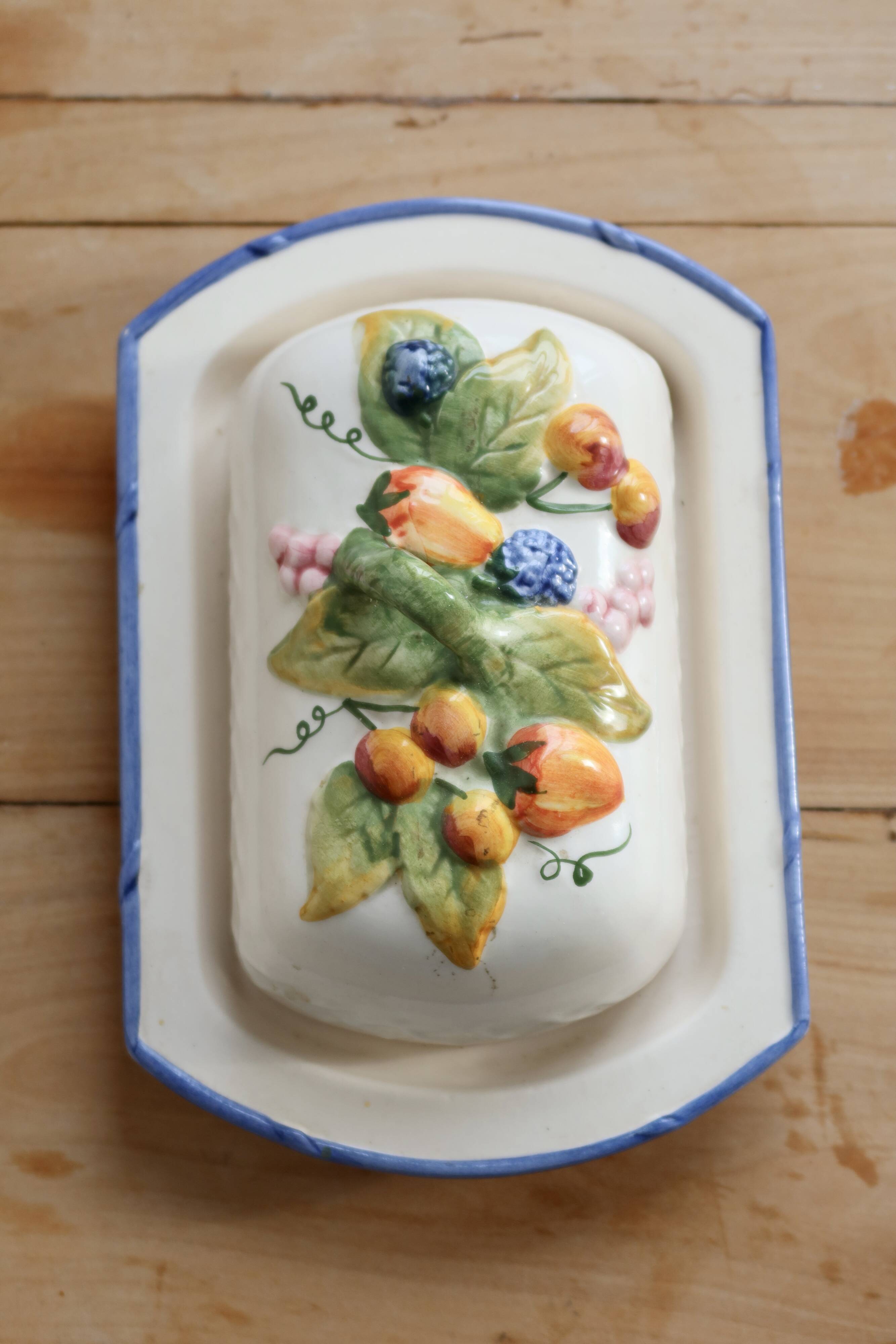 Large vintage faience butter dish with slip decoration – Fruit design