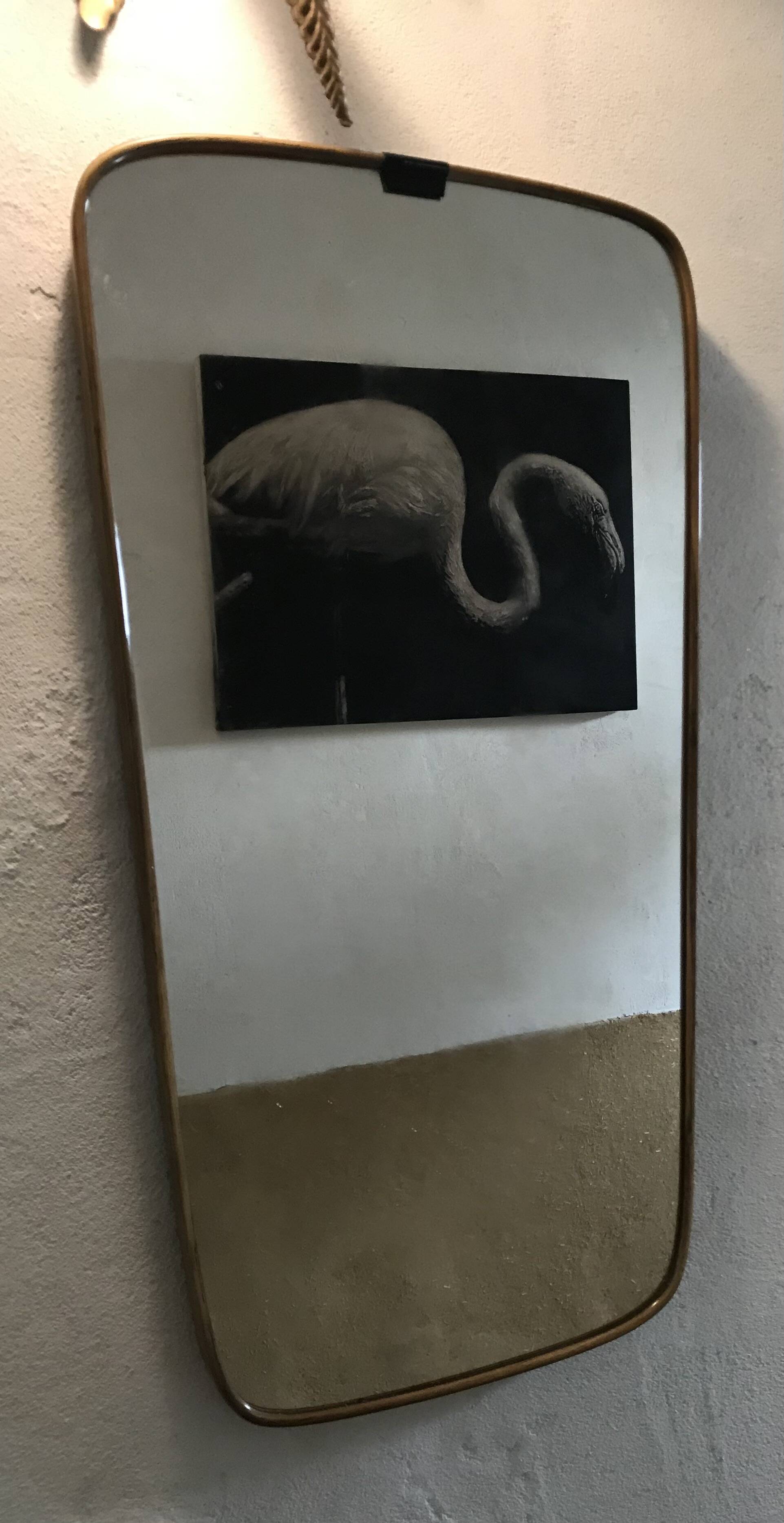 Vintage 1960 free-form mirror known as a rear-view mirror.