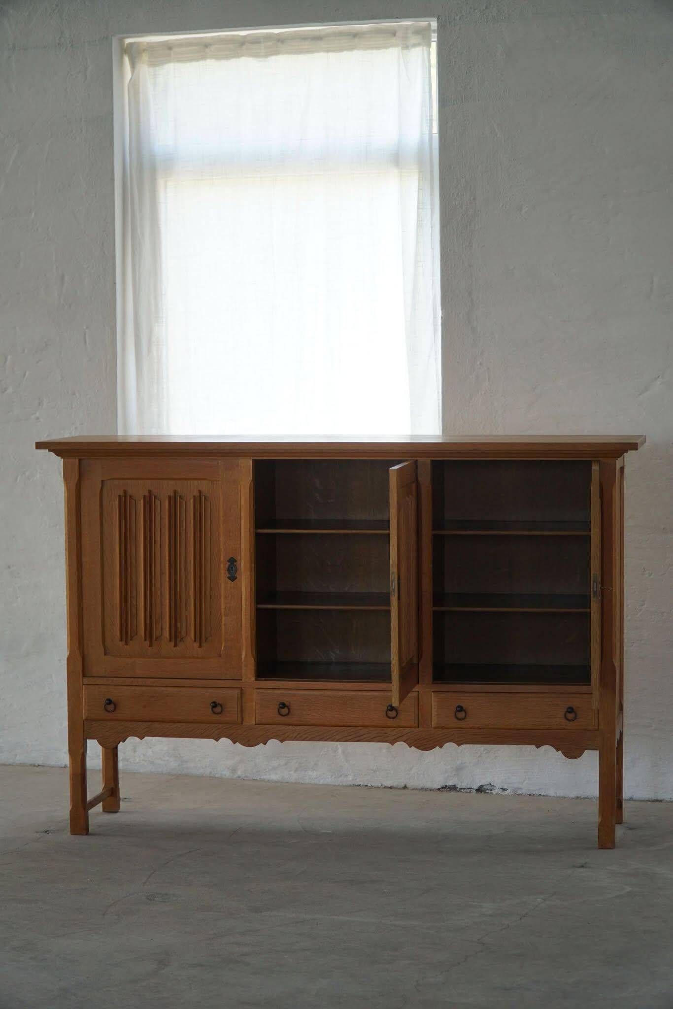 Brutalist oak sideboard, mid-century Danish design, Kjærnulf style, 1960s.