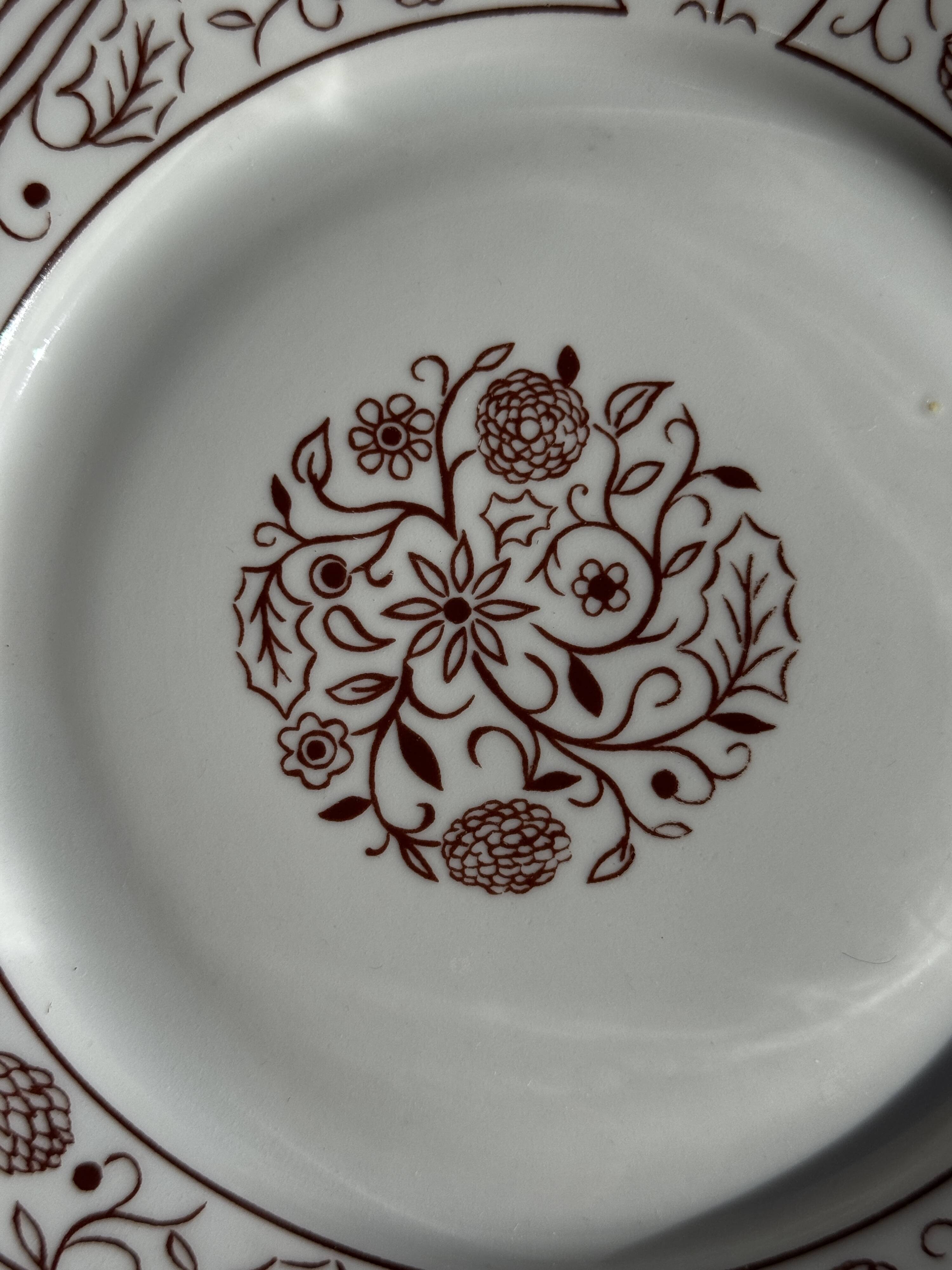 Set of 6 vintage dessert plates made in Poland with a plant motif.