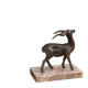Vintage antelope gazelle bookend in patinated metal on a marble base.