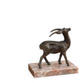 Vintage antelope gazelle bookend in patinated metal on a marble base.