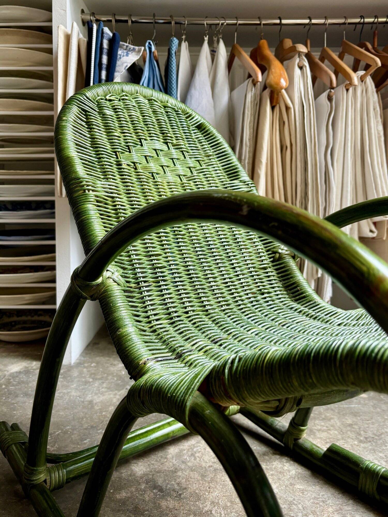 Children's rocking chair in woven wicker and green rattan