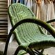 Children's rocking chair in woven wicker and green rattan