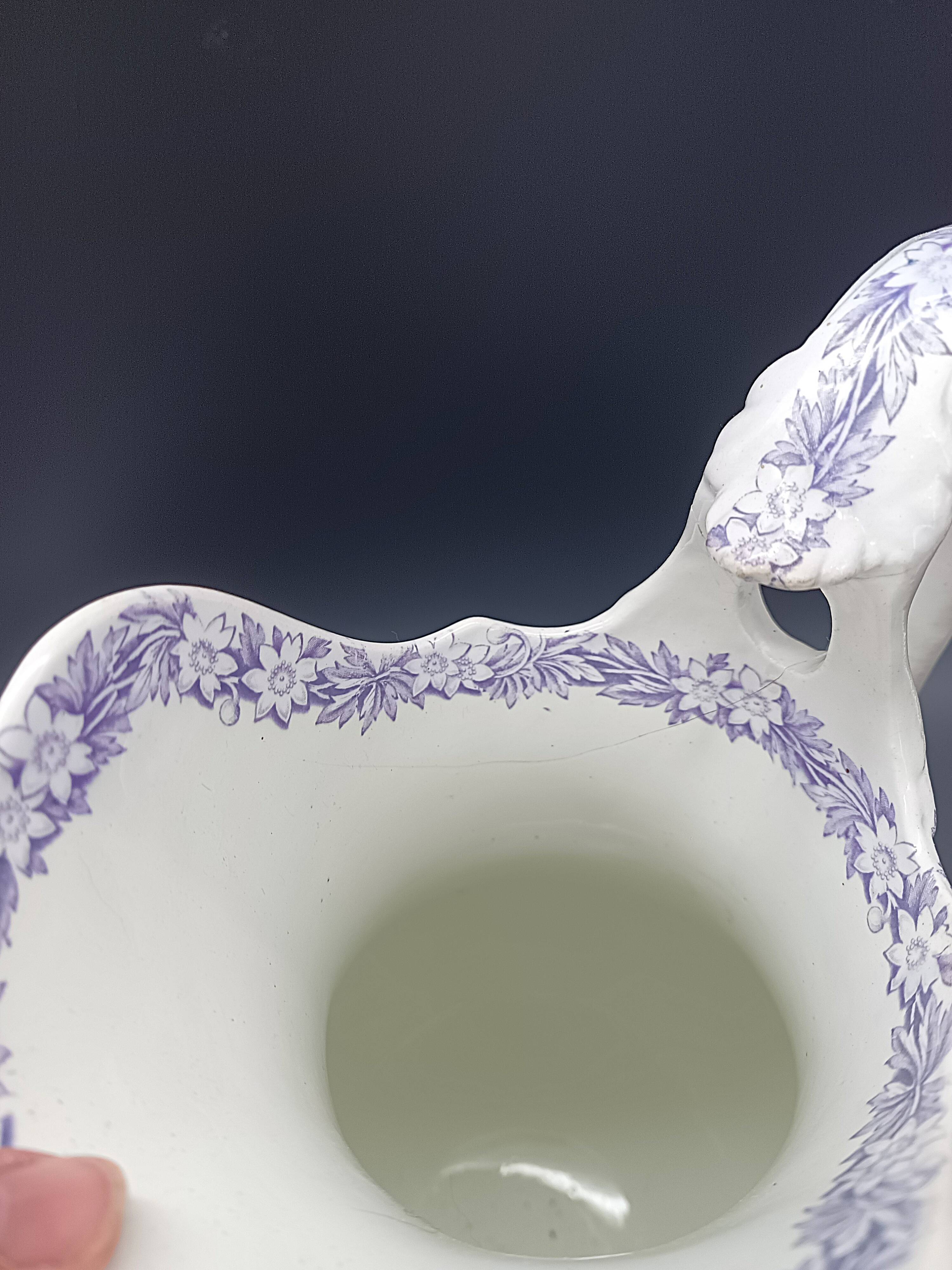 Large antique toilet bowl by Jules Vieillard Bordeaux with violet floral decoration.
