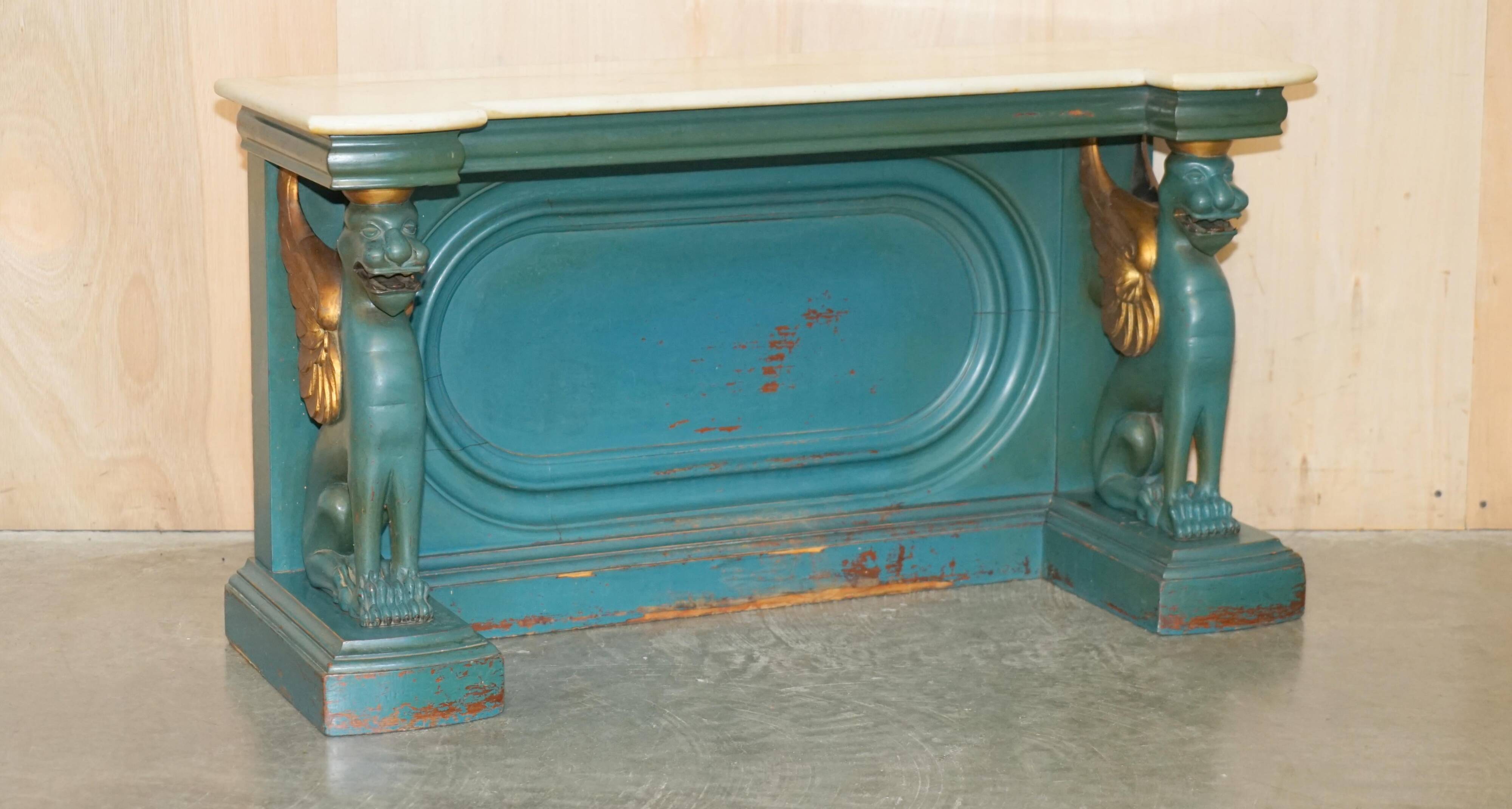 Antique hand-carved console circa 1880 with a marble top.