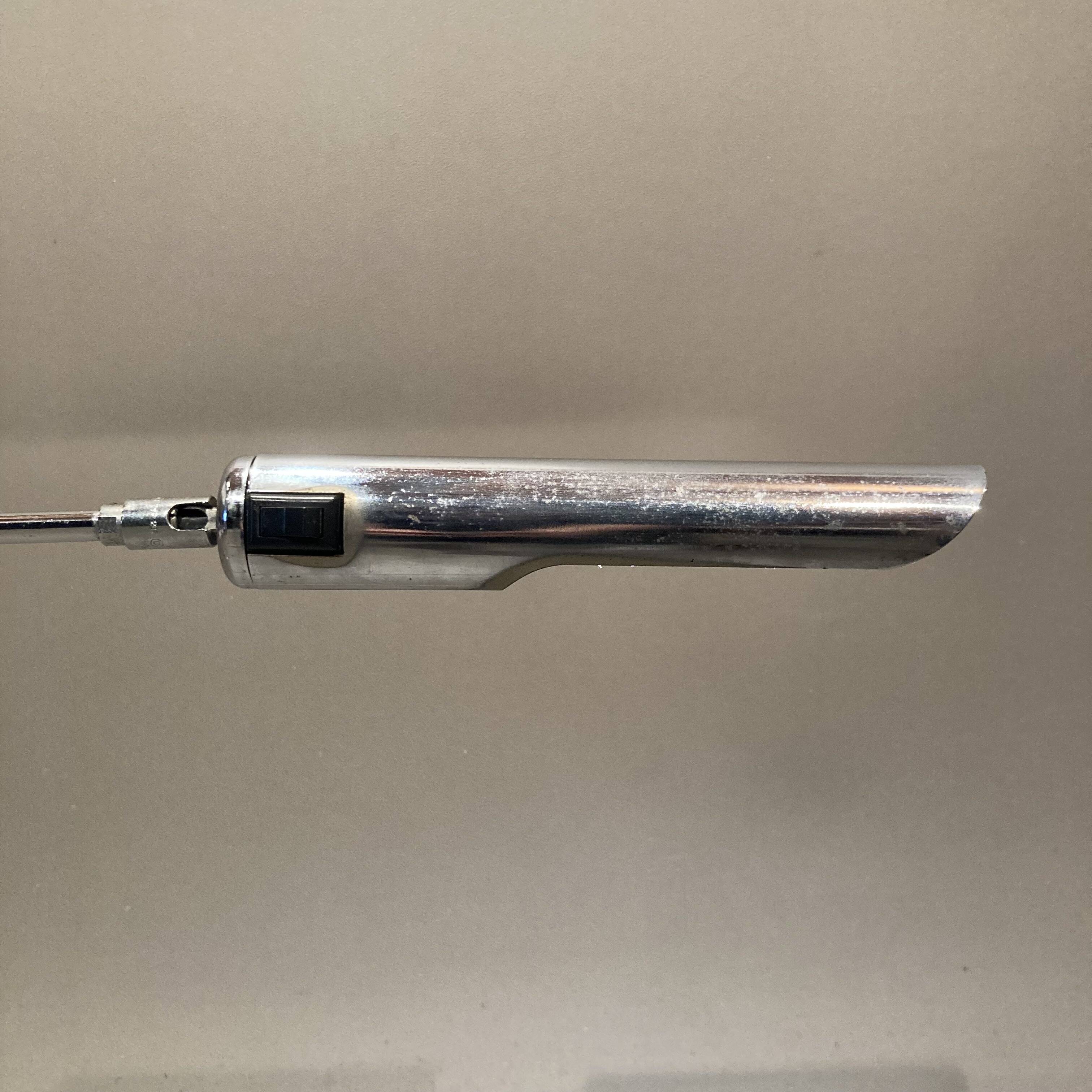 Large modular chrome lamp.