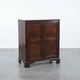 Charming and timeless antique English oak cabinet/commode from the early 19th century with two doors and a working lock