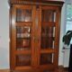 Cabinet ancien en bois et verre marron - vitrine style 1900 à moulures sculptées