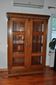 Antique wooden and glass cabinet in brown - 1900 style display case with carved mouldings.