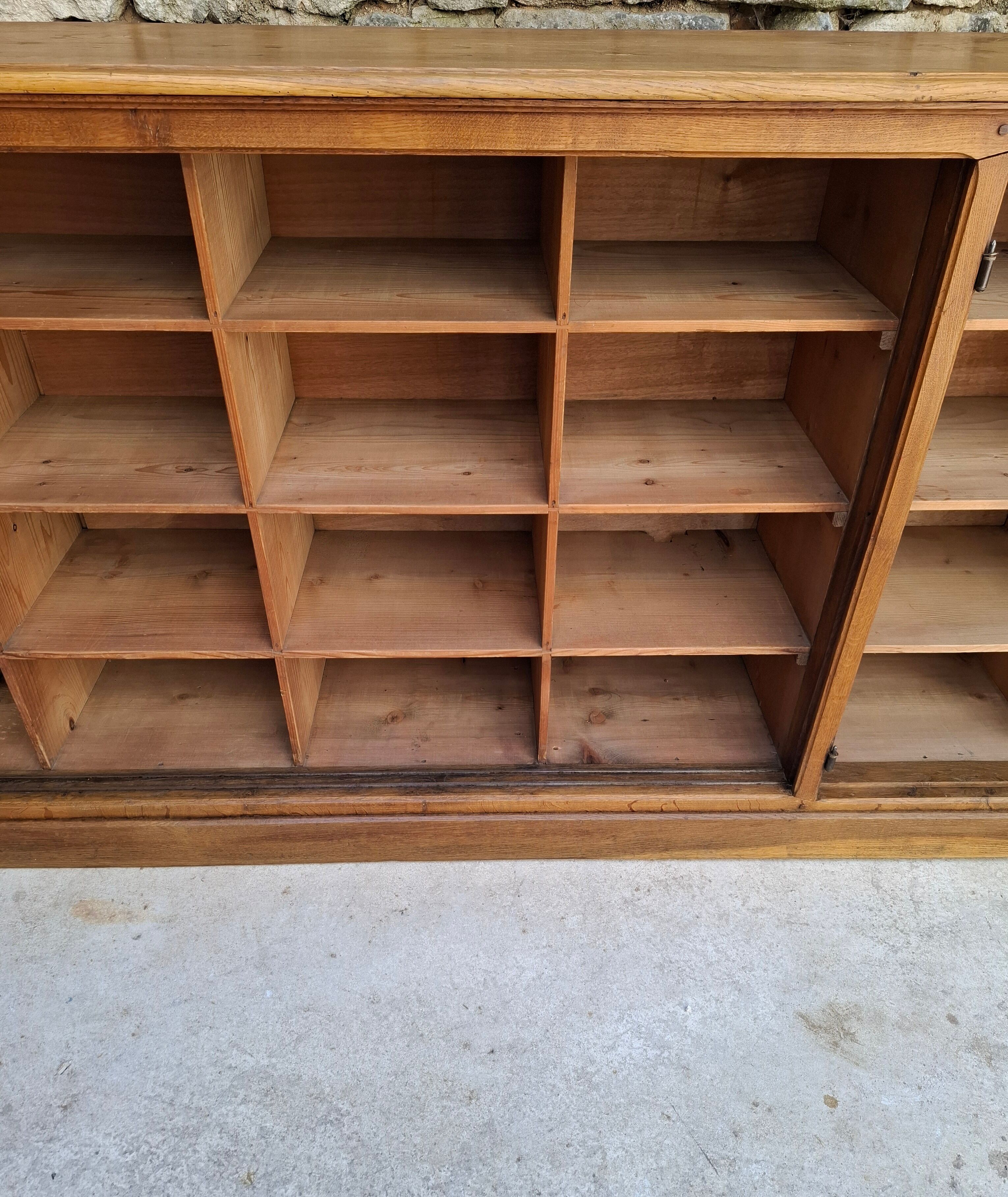 Oak workshop furniture with sliding doors.