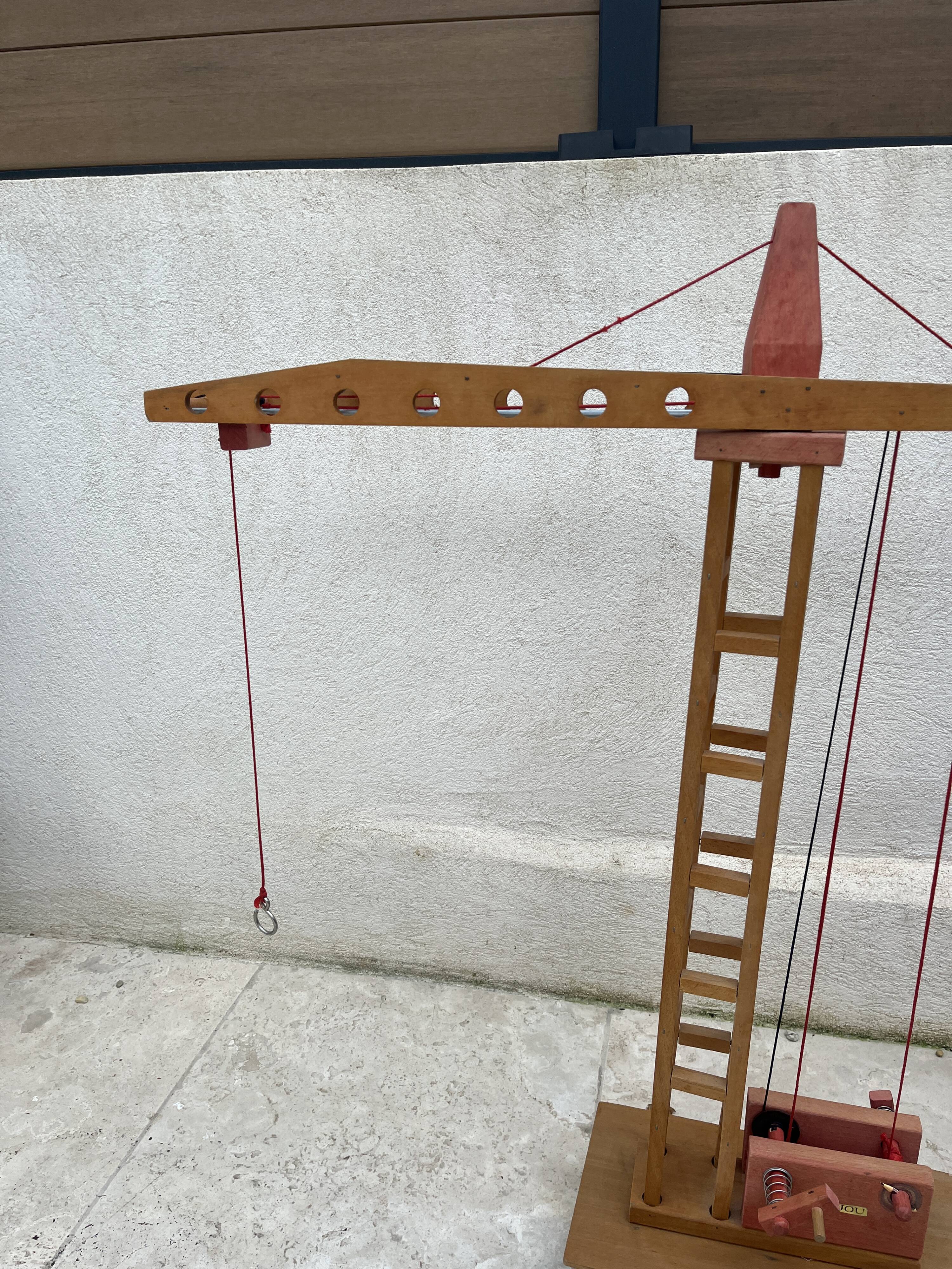 Vintage wooden crane toy from the 60s