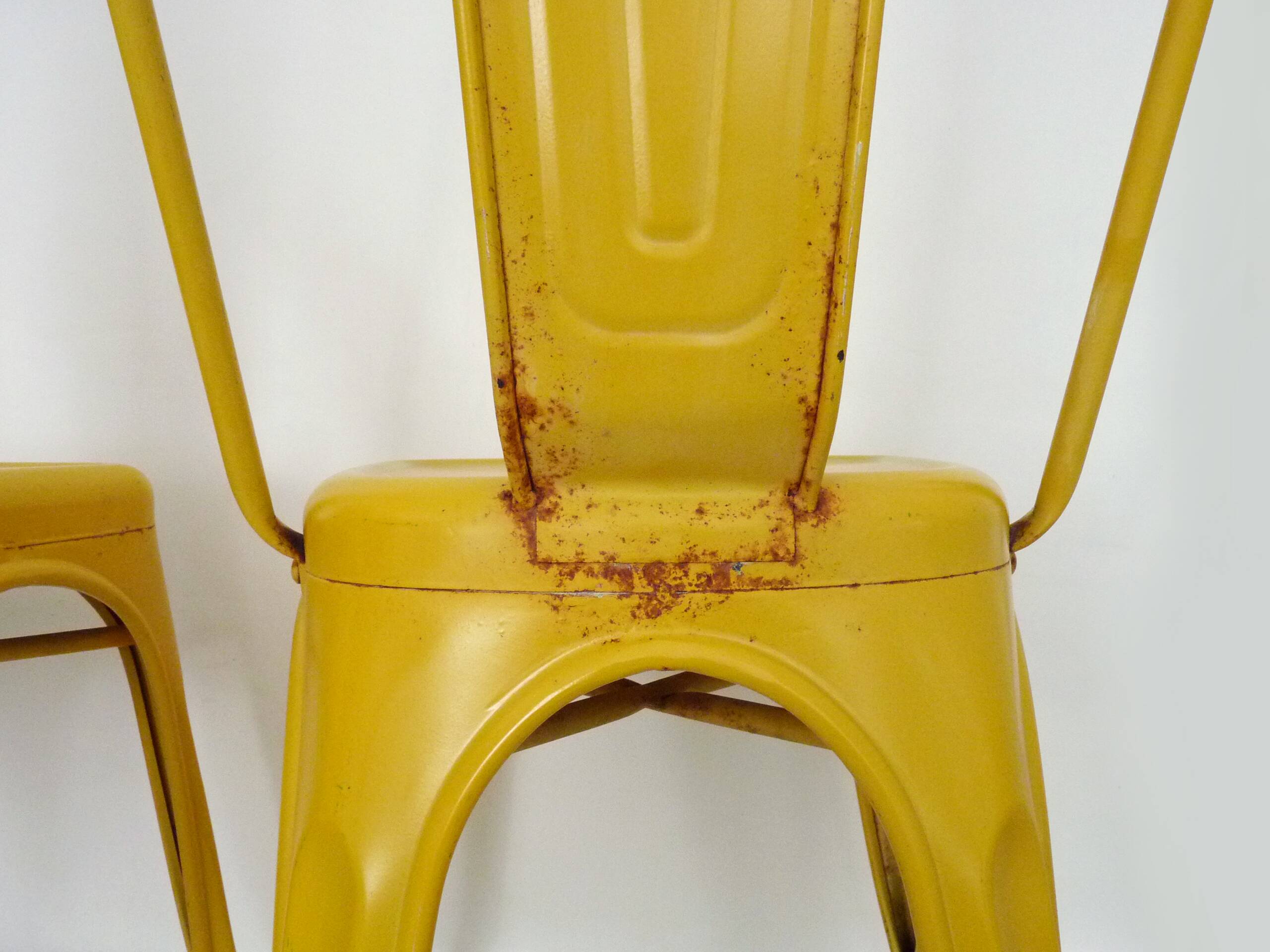 Pair of Tolix Chairs in yellow metal by Xavier Pauchard