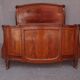 Golden bronze Louis XVI style mahogany bed