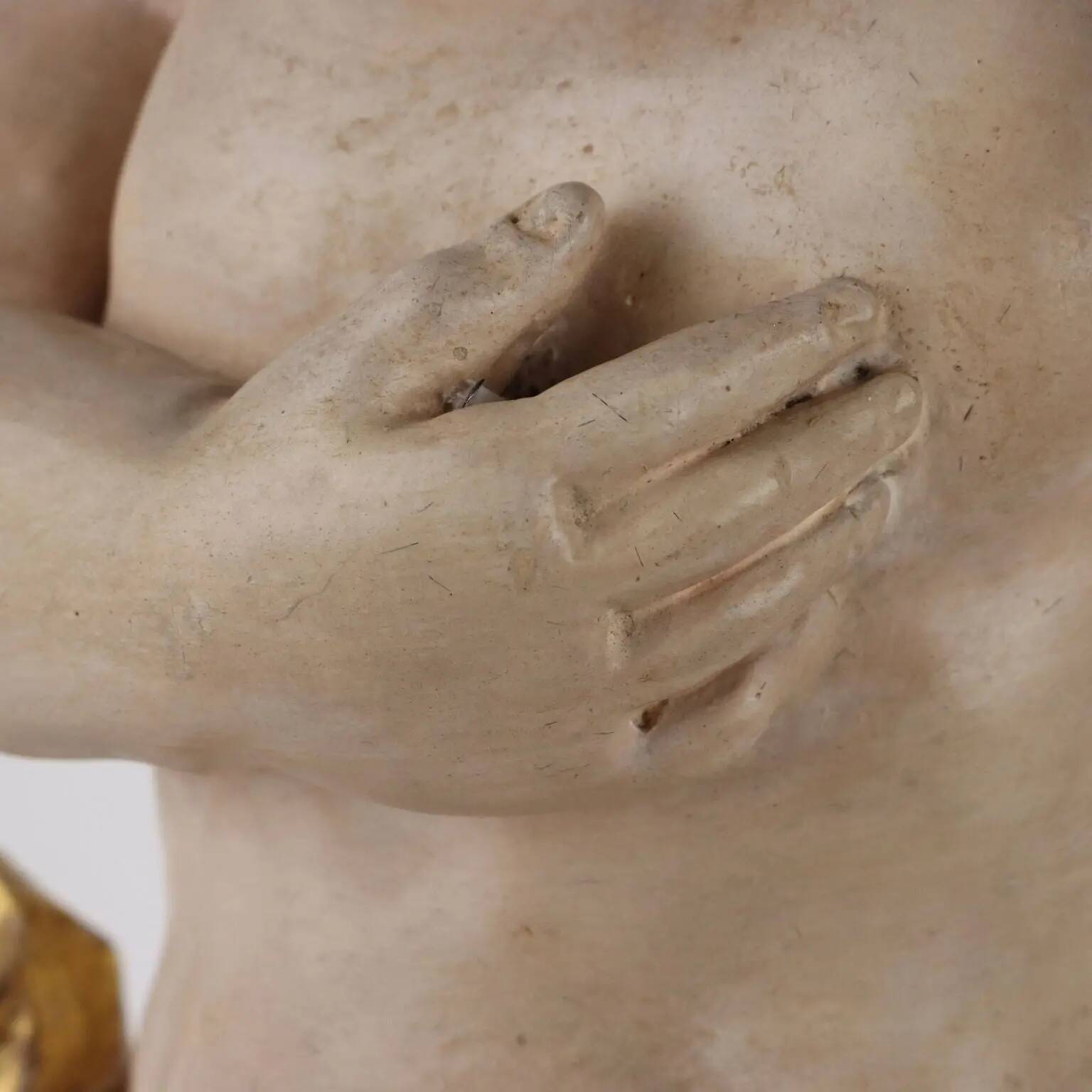 Ancient sculpture of a putto in carved and gilded wood, Italy, 19th century.