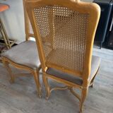 Four antique chairs in classic style with caning and upholstery.
