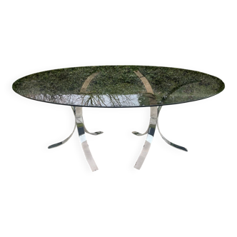 Vintage dining table with chrome legs and smoked glass.