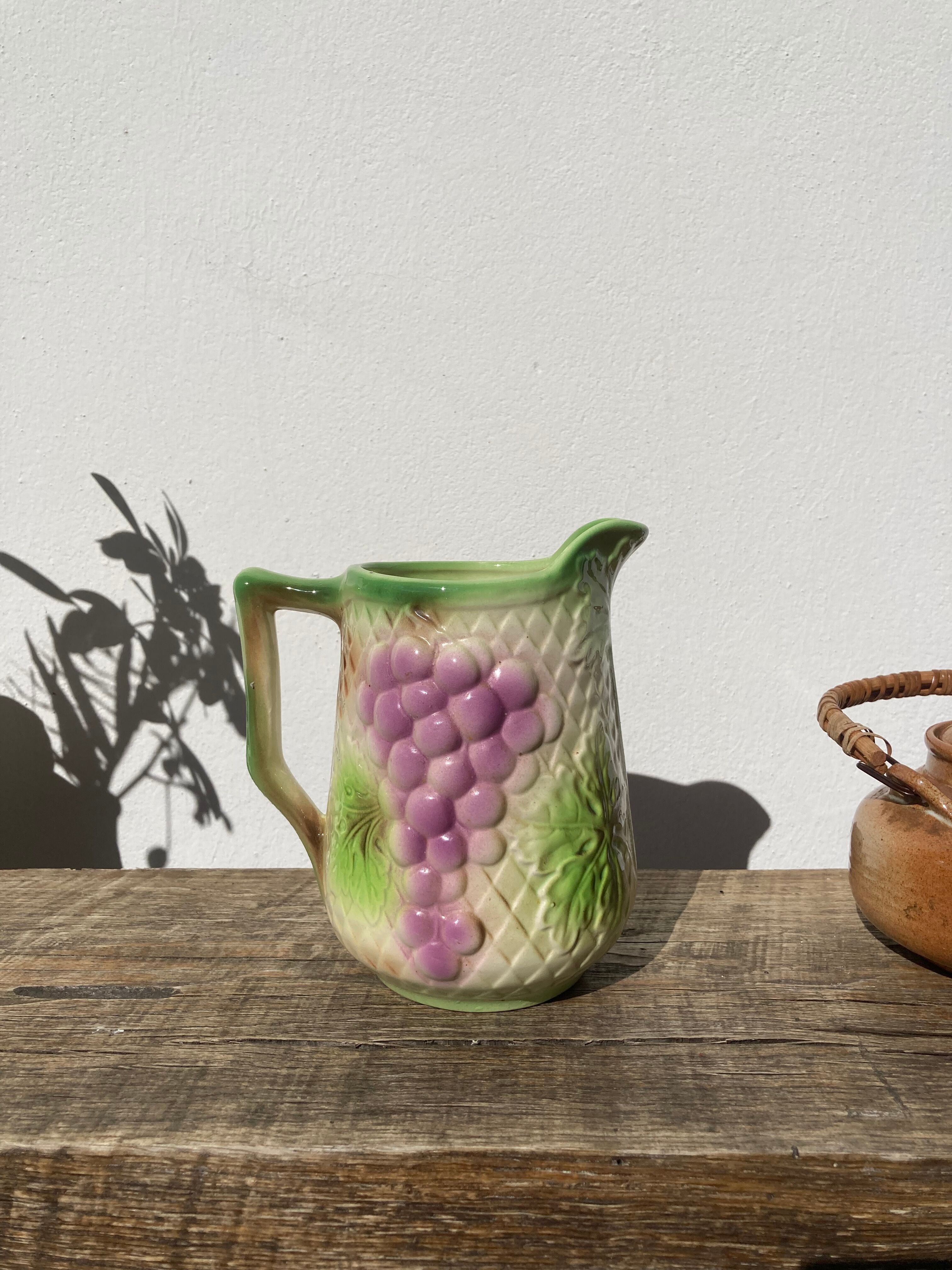 Pitcher in slip - earthenware Saint Clement numbered with fruit and grape basket decoration