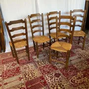 Set of 5 antique solid oak chairs with straw seats.