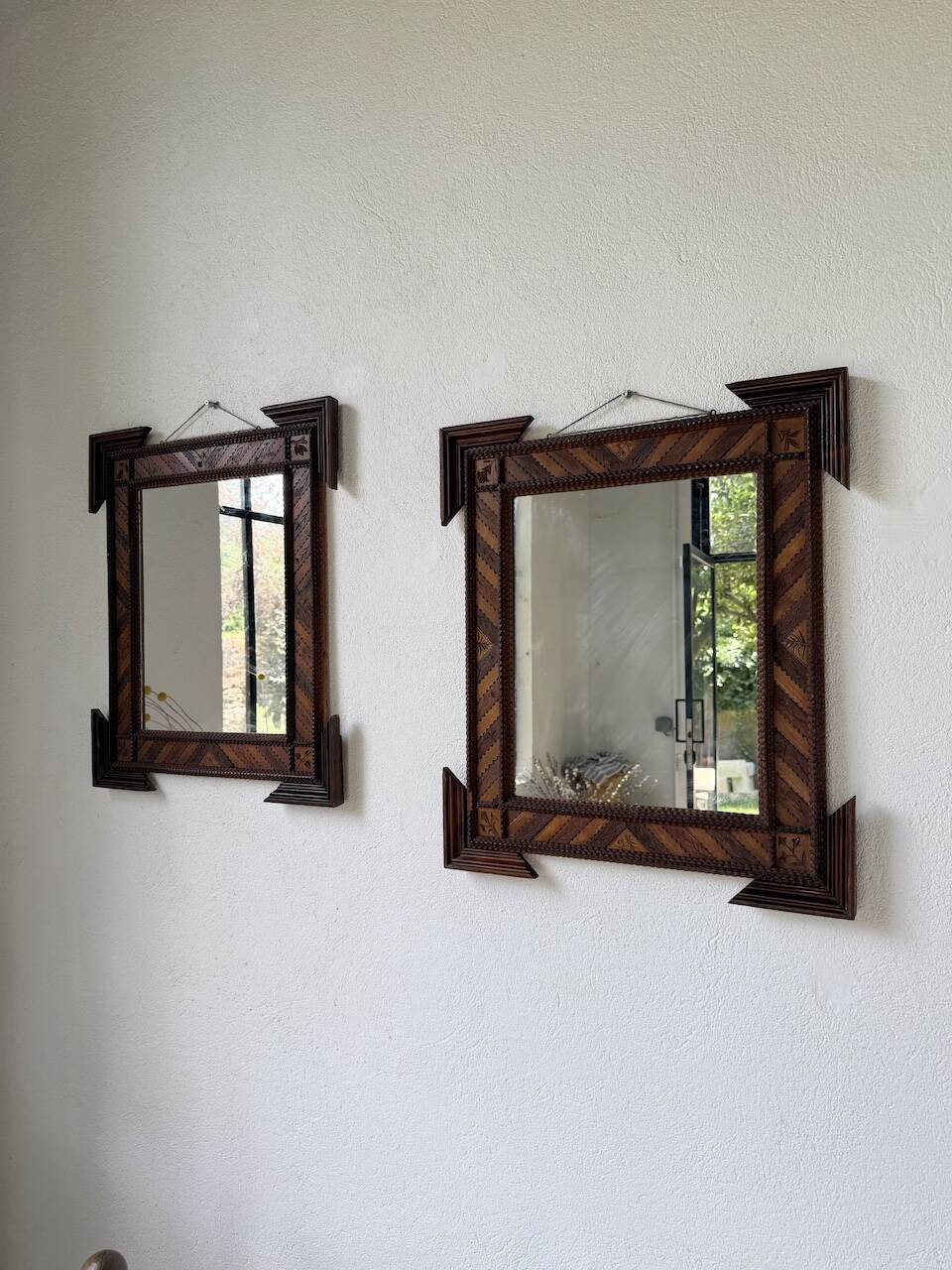 Pair of wooden mirrors in tramp art style