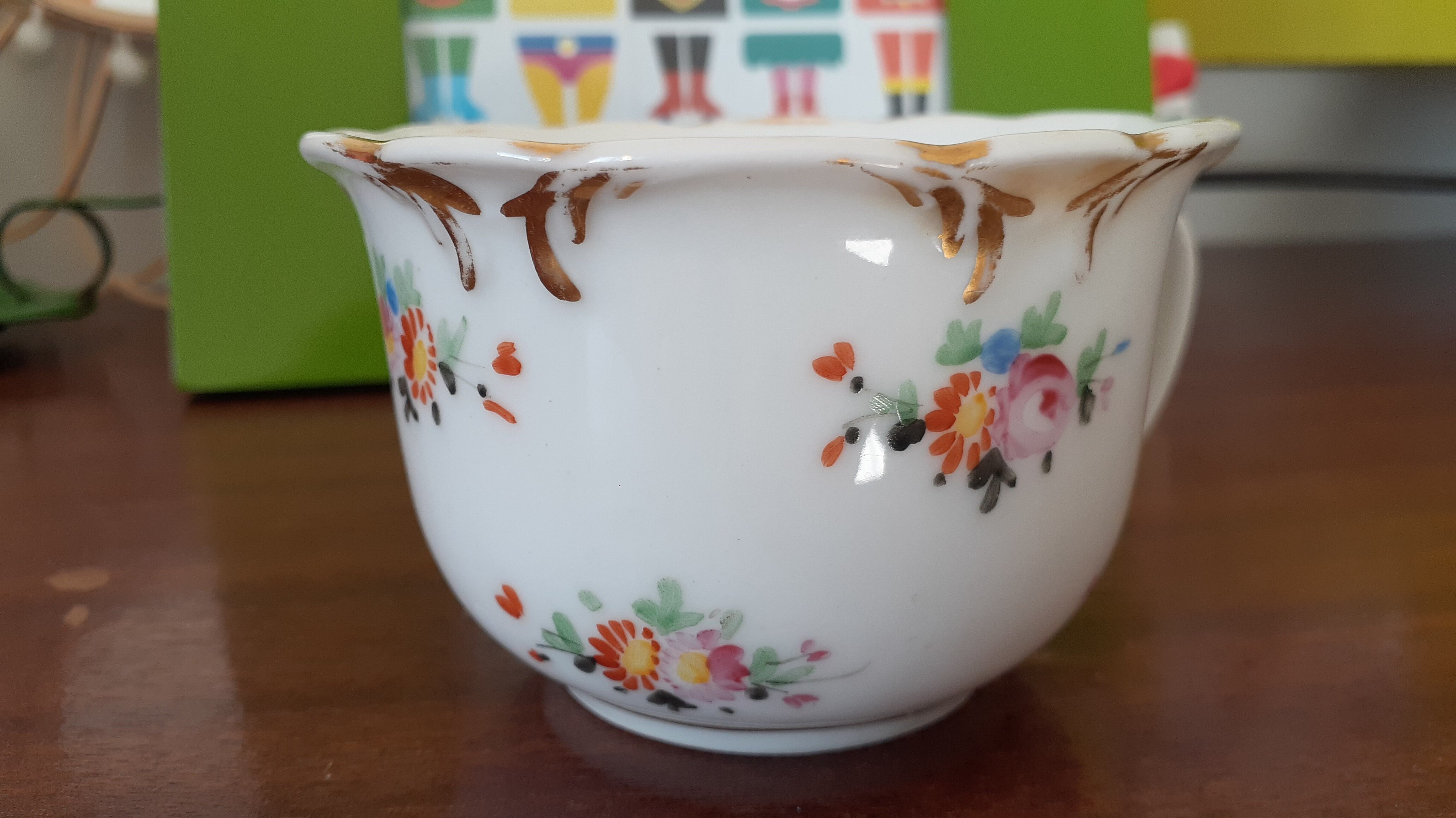 Antique flowered porcelain cup