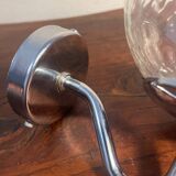 Delmas chrome wall light with chiseled glass globe