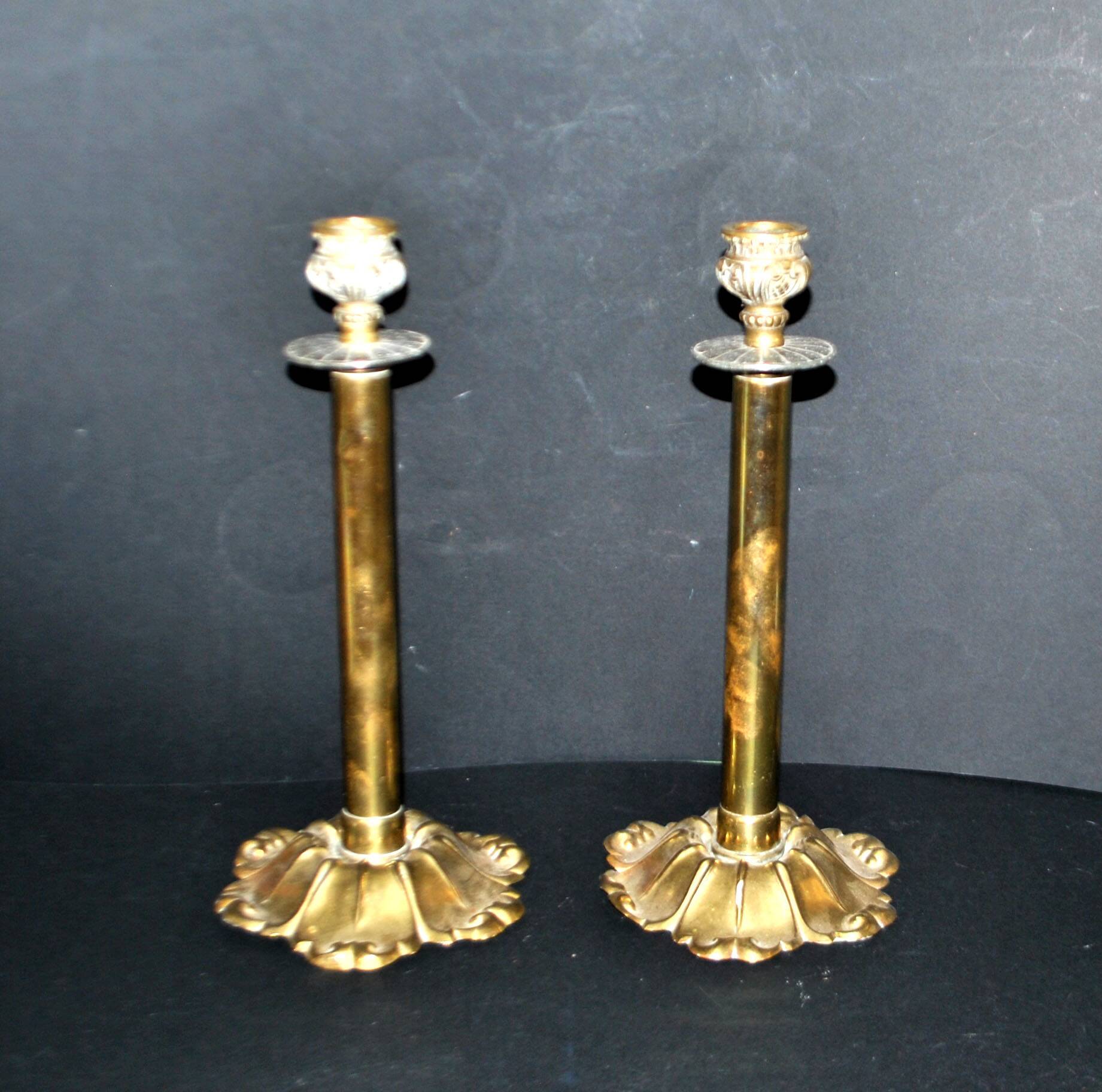 Lot of 2 antique brass and gilded bronze candle holders with acanthus decoration.
