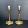 Lot of 2 antique brass and gilded bronze candle holders with acanthus decoration.