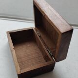 Old wooden box carved with flowers and brass