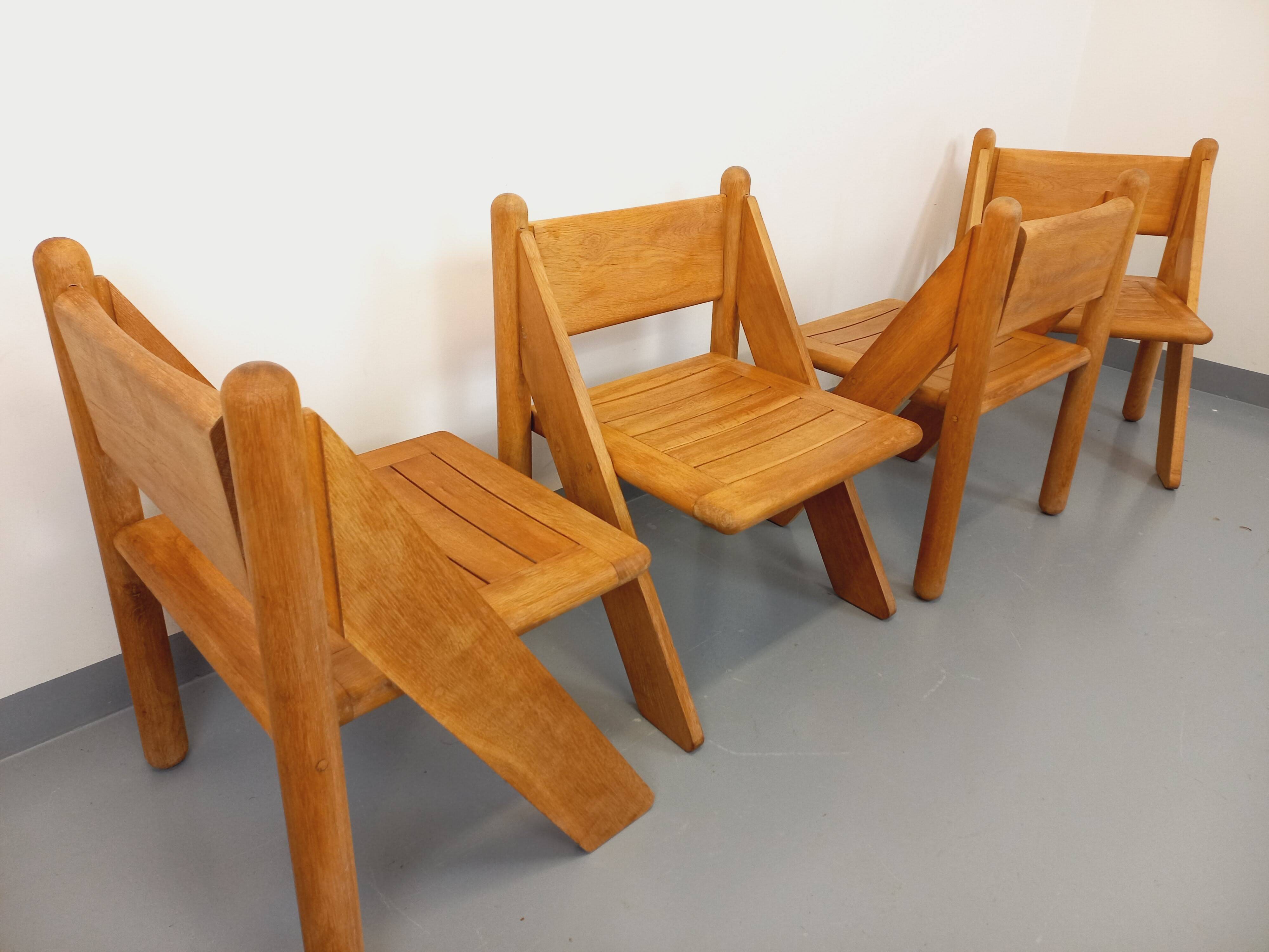 Set of 4 vintage brutalist chairs in solid oak from the 1960s.