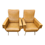 Pair of mustard skaï armchairs, brass feet