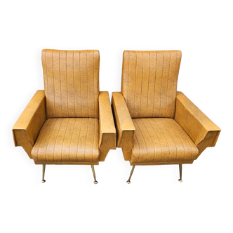 Pair of mustard skaï armchairs, brass feet