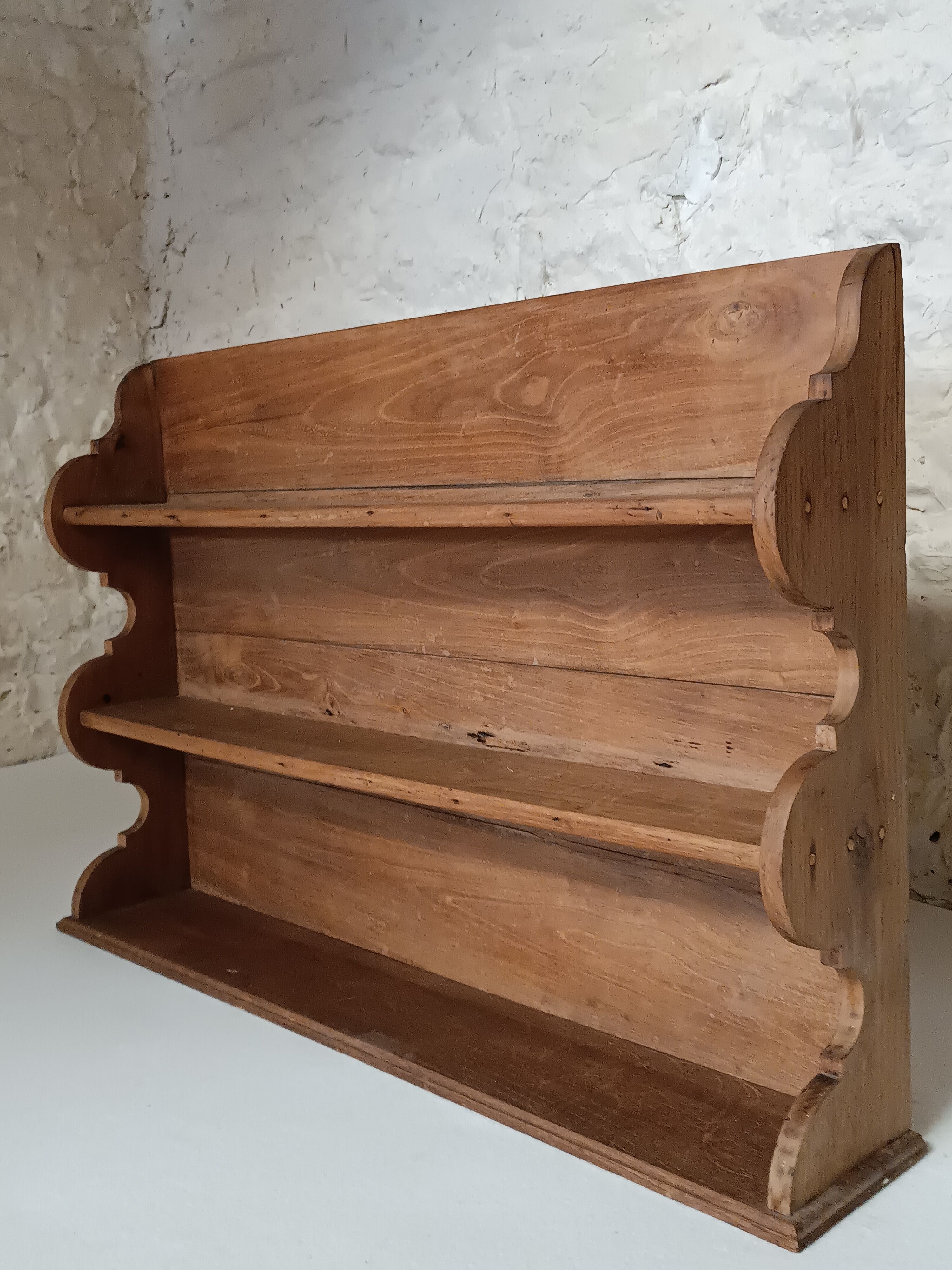 Old wall shelf in raw wood